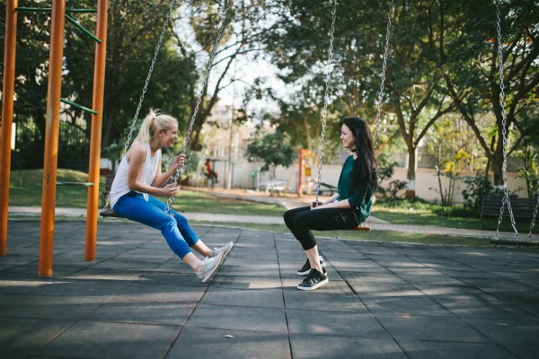 Women on swing sets