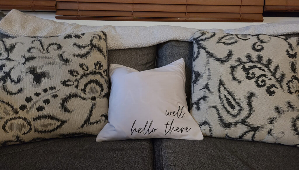 4 Pack Cotton Throw Pillow Cover- 16x16 in off white customized to say "well, hello there" using black htv. Note off white is also more see through than other colors paired with original couch throw pillows on patterned side