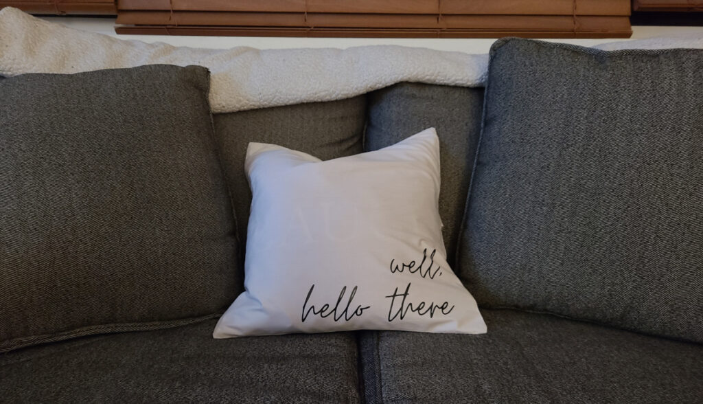 4 Pack Cotton Throw Pillow Cover- 16x16 in off white customized to say "well, hello there" using black htv. Note off white is also more see through than other colors paired with original couch throw pillows on non patterned side