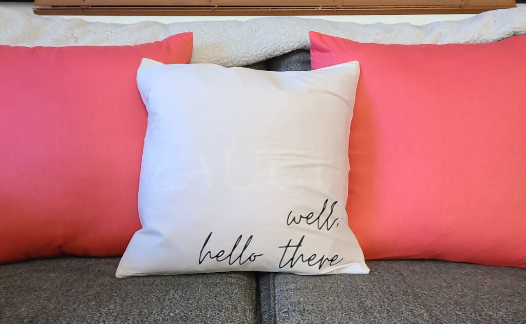 4 Pack Cotton Throw Pillow Cover- 16x16 in off white customized to say "well, hello there" using black htv. Note off white is also more see through than other colors - paired with pink (light red) 18x18