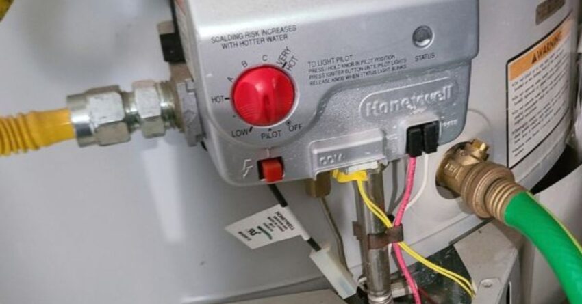 Honeywell Water Heater with hose attached for draining.